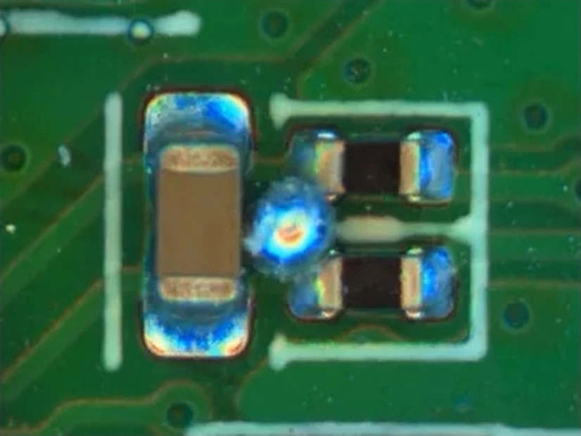 Solder ball detected on the board surface between two mounted components